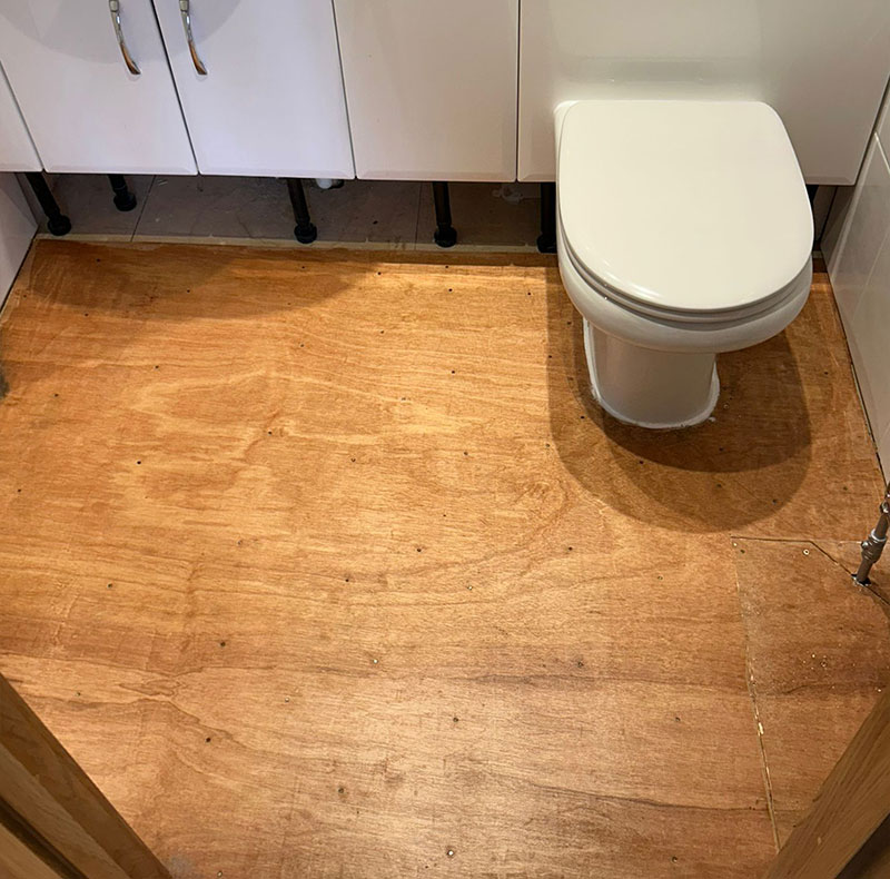 The flooring in the bathroom before Image Flooring installed the new flooring