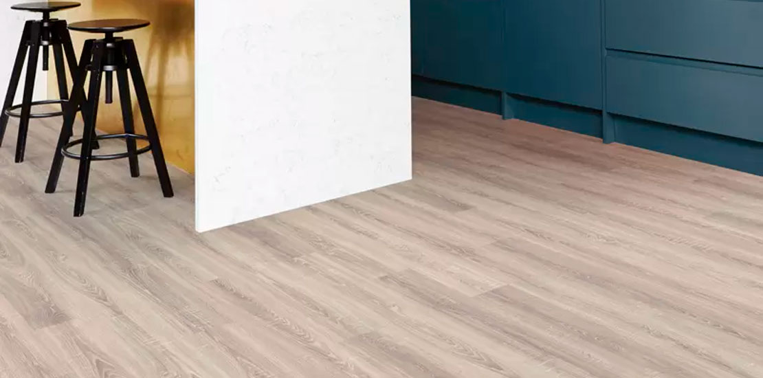 Stylish living room interior with comfortable blue sofa and beige flooring