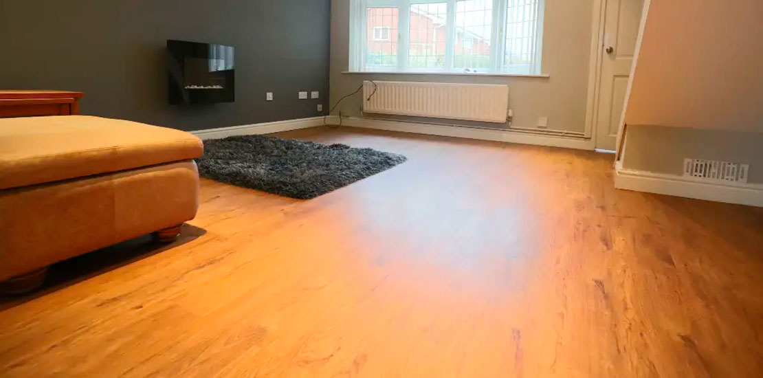 Living area with light grey carpet and sofa